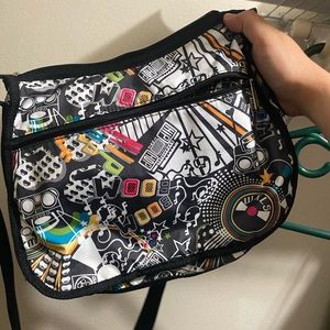 Lesportsac purse - NWOT - black with rock n roll theme - never used